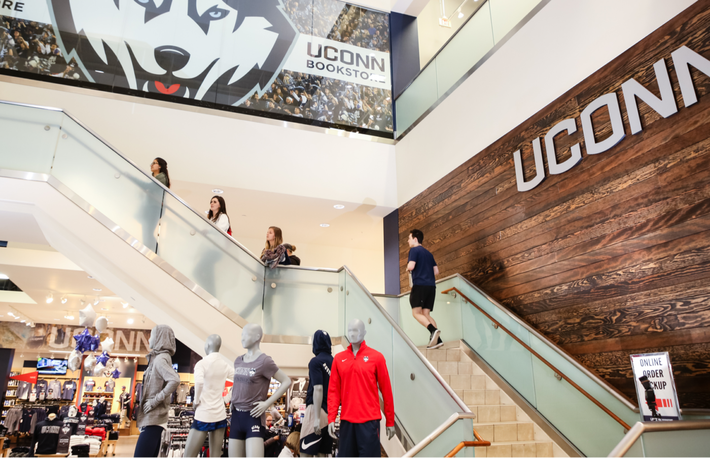 People climbing staircases of a Store