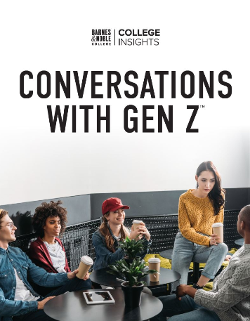 Five students sitting in a cafeteria and chatting with each other