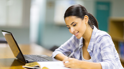 girl writing on a notepad